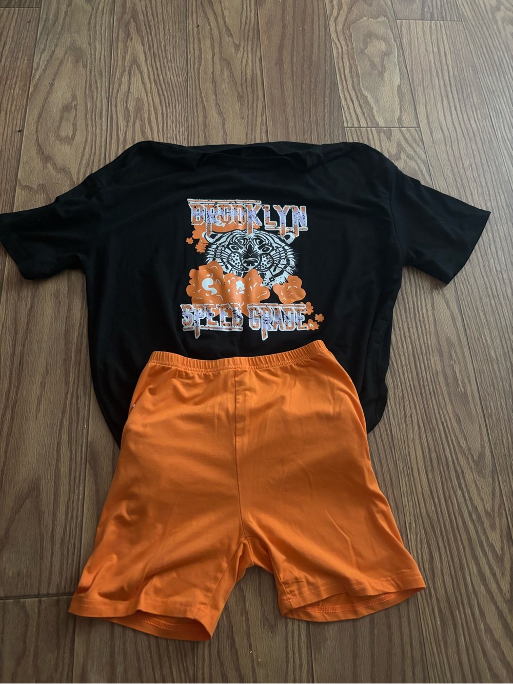 SHEIN Black Graphic Tee with Orange Athletic Shorts